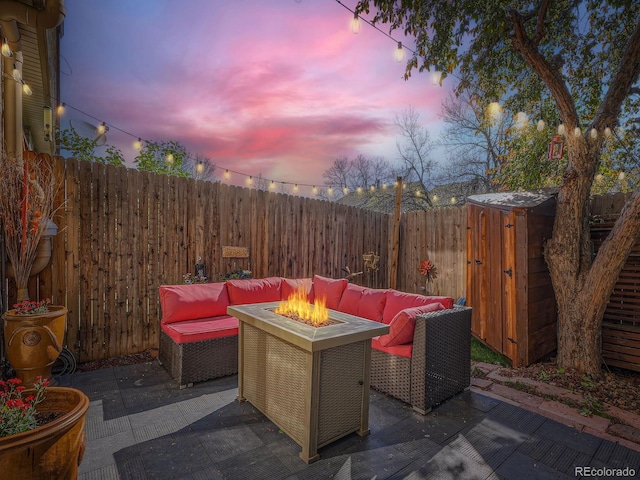 4273 W Ponds Cir, Littleton, CO 80123 - view of patio / terrace with a fire pit and a fenced backyard