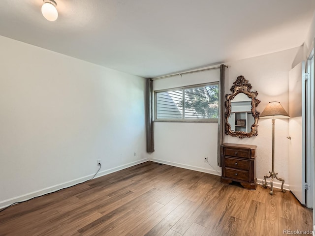 4273 W Ponds Cir, Littleton, CO 80123 - unfurnished bedroom with wood finished floors and baseboards