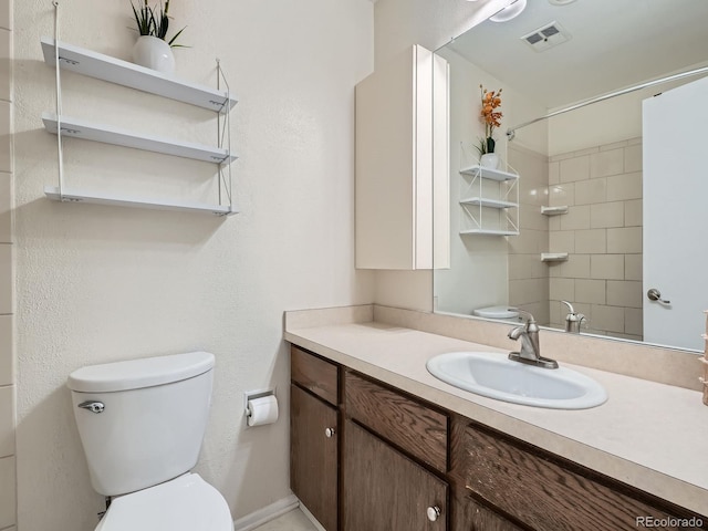 4273 W Ponds Cir, Littleton, CO 80123 - bathroom with toilet, vanity, and baseboards