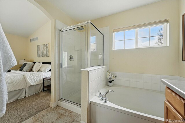 14025 Blue River Trl, Broomfield, CO 80023 - bathroom featuring a garden tub, lofted ceiling, a stall shower, vanity, and ensuite bathroom