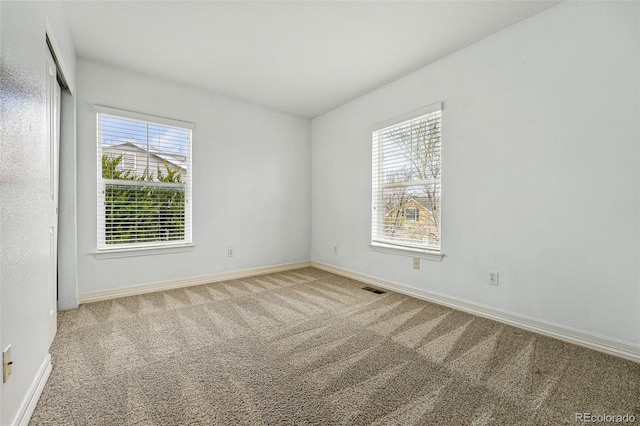 14025 Blue River Trl, Broomfield, CO 80023 - spare room with healthy amount of natural light, carpet flooring, and baseboards