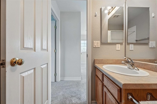 14025 Blue River Trl, Broomfield, CO 80023 - bathroom featuring vanity and baseboards