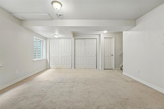 14025 Blue River Trl, Broomfield, CO 80023 - unfurnished bedroom with multiple closets, carpet floors, and baseboards