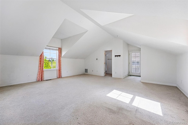 14025 Blue River Trl, Broomfield, CO 80023 - bonus room featuring light carpet, lofted ceiling, and baseboards