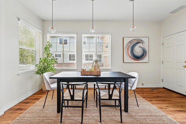 14025 Blue River Trl, Broomfield, CO 80023 - dining area with wood finished floors and baseboards