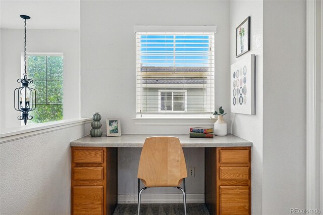 14025 Blue River Trl, Broomfield, CO 80023 - home office featuring built in desk and baseboards