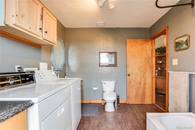 clothes washing area with separate washer and dryer