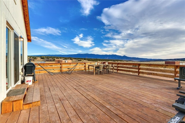 wooden deck with a mountain view