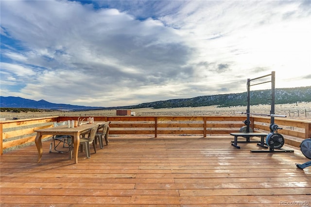 wooden deck with a mountain view