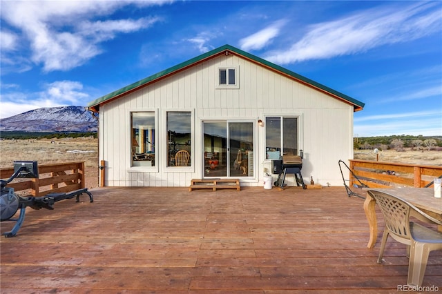 wooden deck with a mountain view