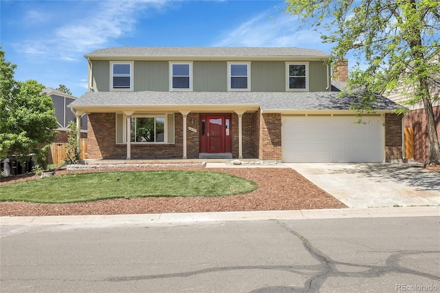 3653 E 133rd Ct, Thornton, CO 80241 - view of front facade featuring driveway, an attached garage, a chimney, and brick siding