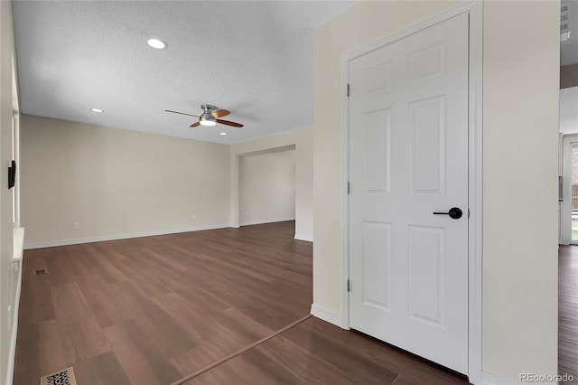 3653 E 133rd Ct, Thornton, CO 80241 - spare room with a ceiling fan, a textured ceiling, dark wood-style floors, baseboards, and recessed lighting