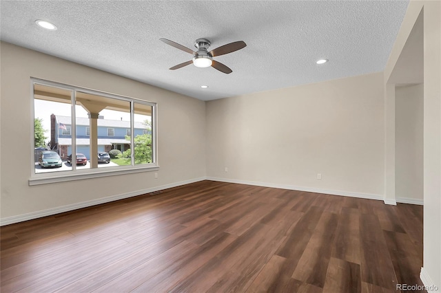 3653 E 133rd Ct, Thornton, CO 80241 - spare room with a ceiling fan, dark wood finished floors, a textured ceiling, baseboards, and recessed lighting