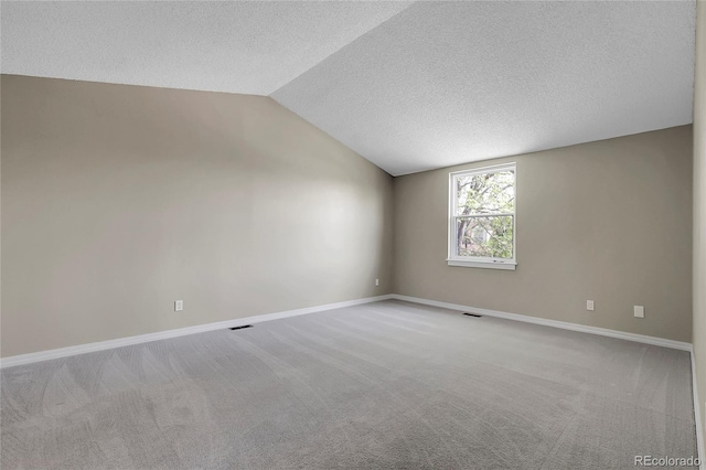 3653 E 133rd Ct, Thornton, CO 80241 - carpeted spare room featuring lofted ceiling, a textured ceiling, and baseboards