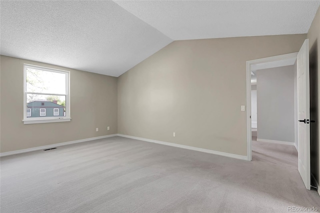 3653 E 133rd Ct, Thornton, CO 80241 - bonus room with lofted ceiling, light carpet, a textured ceiling, and baseboards