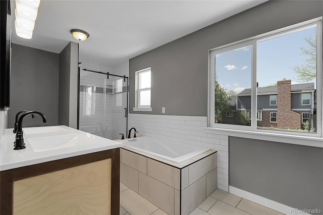 3653 E 133rd Ct, Thornton, CO 80241 - bathroom featuring a shower stall, a bath, tile patterned flooring, and a sink
