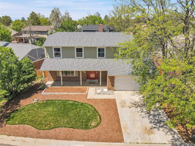 3653 E 133rd Ct, Thornton, CO 80241 - view of front of home featuring a porch, roof with shingles, concrete driveway, and brick siding