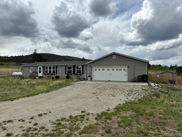 1326 Kaufman Rd, Hartsel, CO 80449 - ranch-style house with dirt driveway and a garage