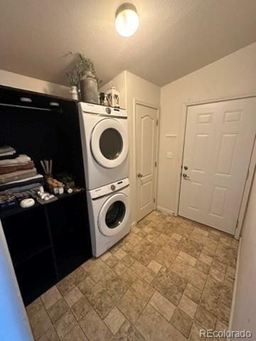 1326 Kaufman Rd, Hartsel, CO 80449 - laundry area featuring estacked washer and dryer and stone finish floors