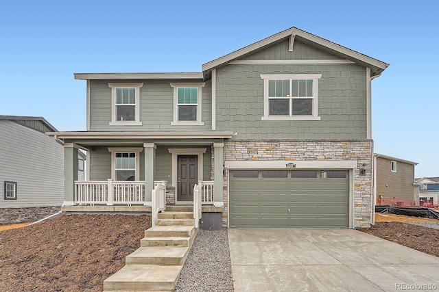 front facade with covered porch and a garage