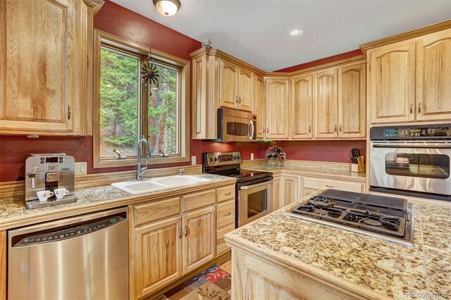 322 Davis Ct, Breckenridge, CO 80424 - kitchen with stainless steel appliances, light countertops, light brown cabinetry, and recessed lighting