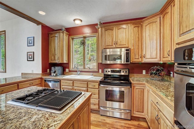 322 Davis Ct, Breckenridge, CO 80424 - kitchen featuring appliances with stainless steel finishes, light wood-style floors, and tile countertops