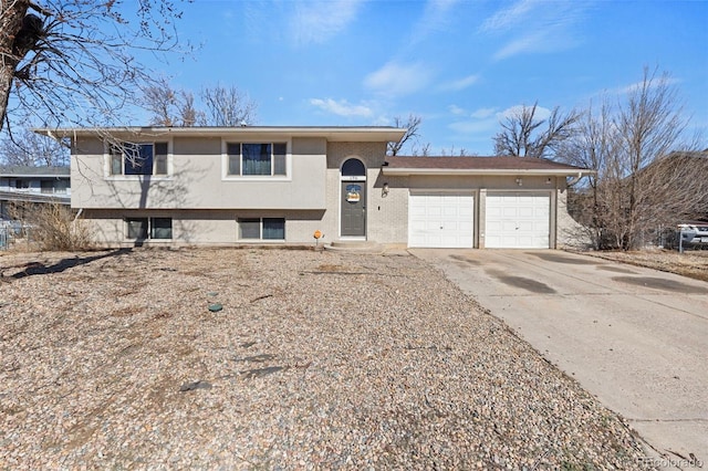 split level home with driveway and an attached garage