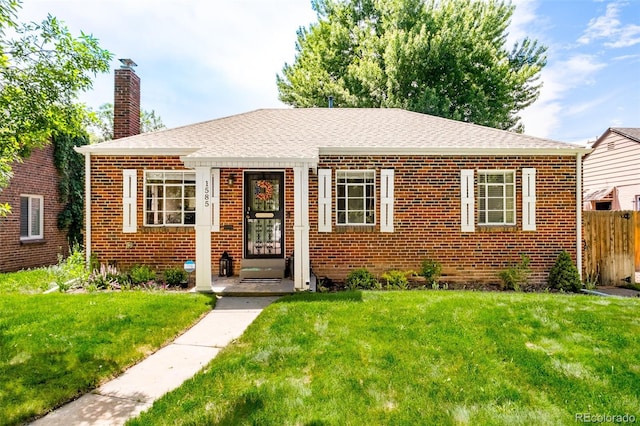 bungalow with a front lawn