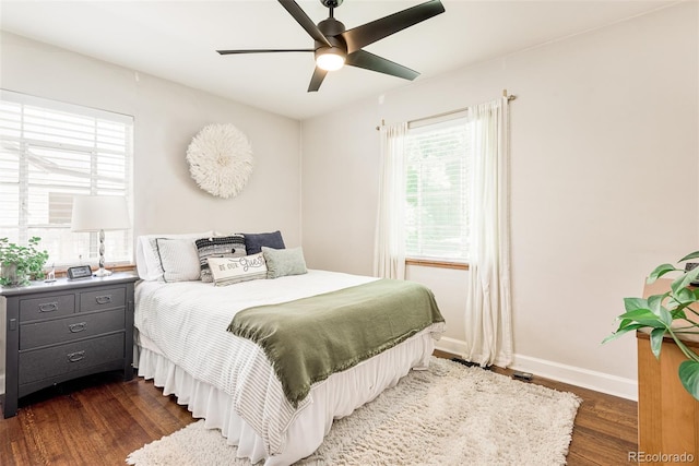 bedroom featuring ceiling fan and dark hardwood / wood-style flooring