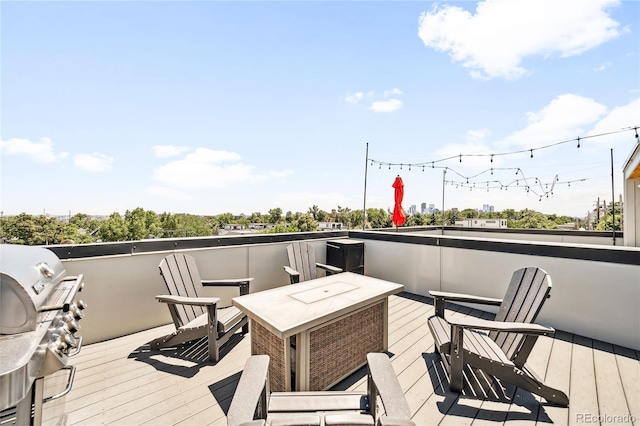 wooden deck featuring area for grilling