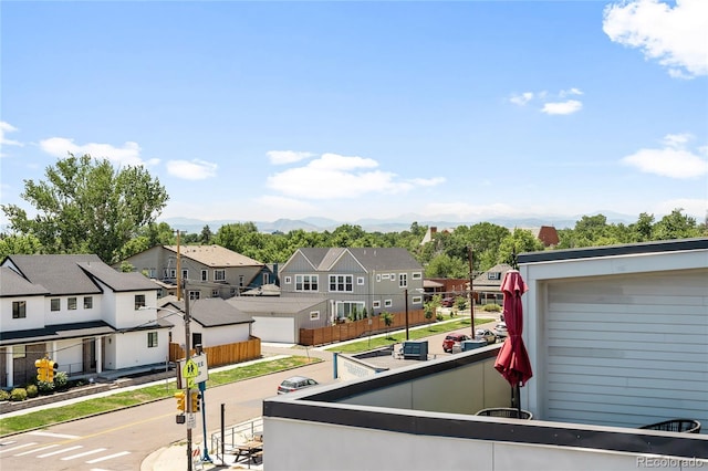 balcony with a residential view and a mountain view