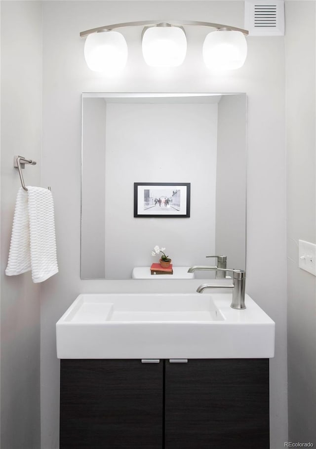 bathroom with vanity and visible vents