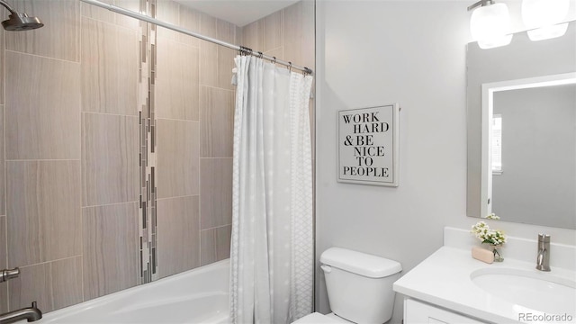 bathroom featuring shower / bath combination with curtain, vanity, and toilet