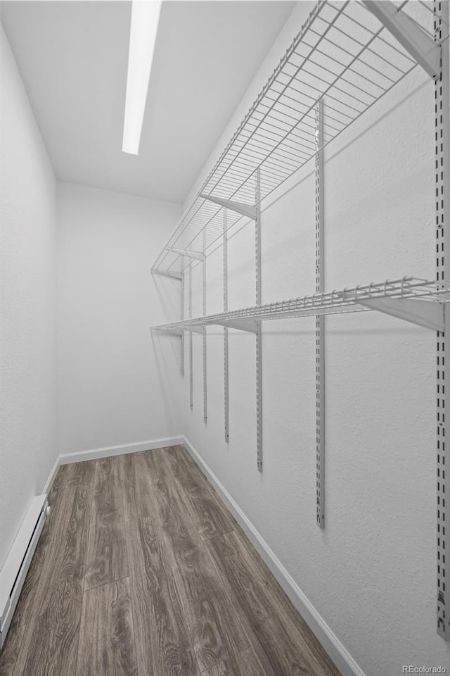 1035 Iris St, Broomfield, CO 80020 - walk in closet with baseboard heating and wood finished floors
