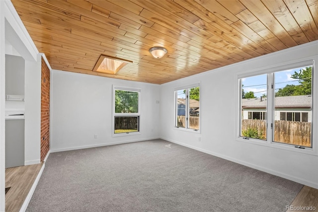 1035 Iris St, Broomfield, CO 80020 - empty room with wooden ceiling, carpet flooring, and a skylight