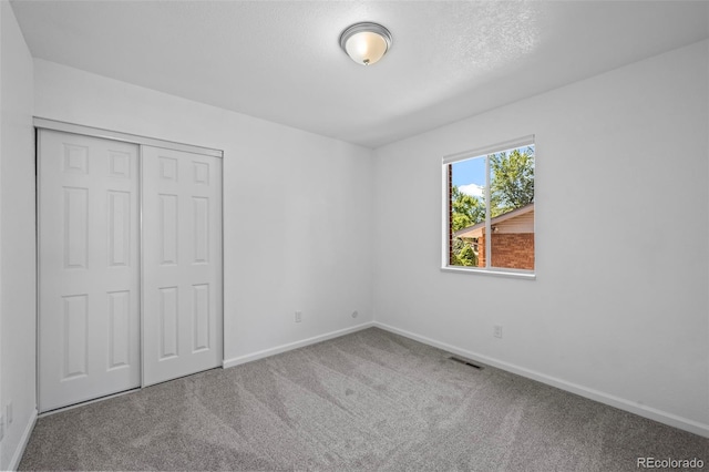 1035 Iris St, Broomfield, CO 80020 - unfurnished bedroom featuring carpet and a closet