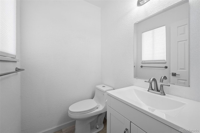 1035 Iris St, Broomfield, CO 80020 - half bath featuring vanity and wood finished floors