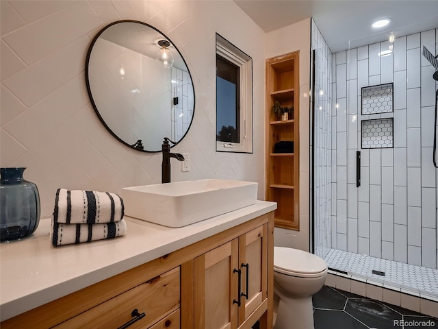 8916 Sunridge Hollow Rd, Parker, CO 80134 - full bathroom featuring vanity, tile patterned floors, a tile shower, and toilet