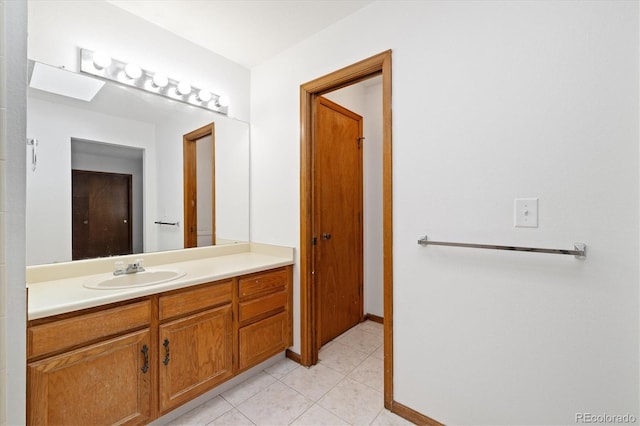 1770 S Quintero Way, Aurora, CO 80017 - bathroom with tile patterned floors, baseboards, and vanity