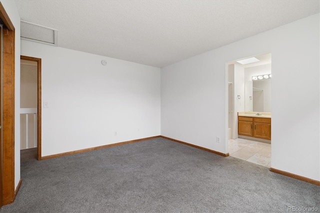 1770 S Quintero Way, Aurora, CO 80017 - unfurnished bedroom with baseboards, light carpet, attic access, and a sink
