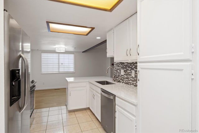 1770 S Quintero Way, Aurora, CO 80017 - kitchen featuring a sink, light tile patterned flooring, white cabinets, and appliances with stainless steel finishes