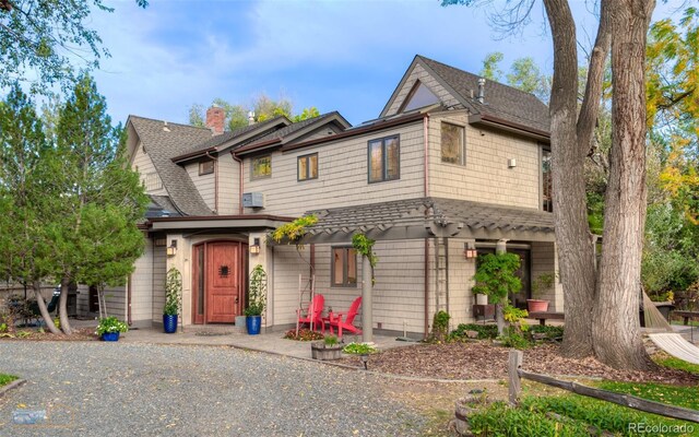 3737 26th St, Boulder, CO 80304 - view of front of home featuring a shingled roof and a chimney