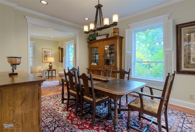 3737 26th St, Boulder, CO 80304 - dining space featuring plenty of natural light, light wood-style floors, a chandelier, recessed lighting, and ornamental molding