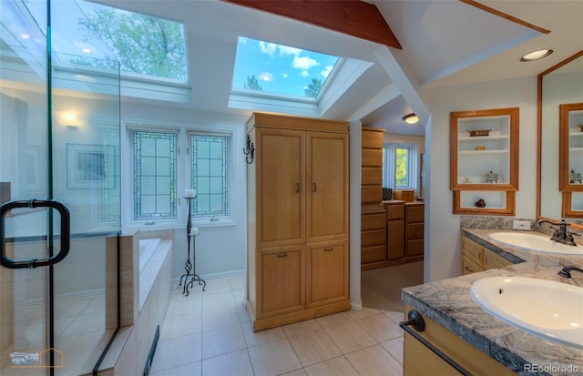 3737 26th St, Boulder, CO 80304 - full bathroom featuring a skylight, two vanities, tile patterned floors, a bathtub, and a stall shower