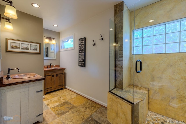 3737 26th St, Boulder, CO 80304 - full bath featuring a shower stall, two vanities, stone finish flooring, and recessed lighting
