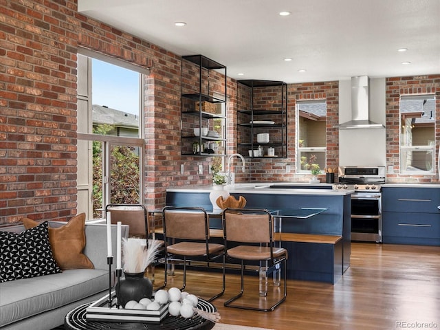 8336 E 35th Ave, Denver, CO 80238 - kitchen with wall chimney exhaust hood, double oven range, open shelves, wood finished floors, and a sink