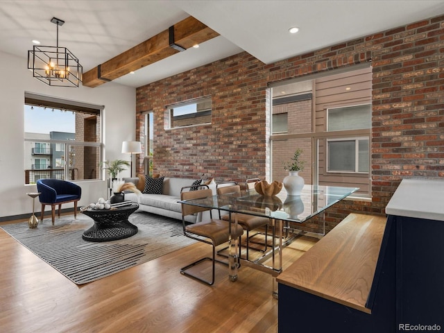 8336 E 35th Ave, Denver, CO 80238 - living room featuring wood finished floors, brick wall, beam ceiling, a chandelier, and recessed lighting