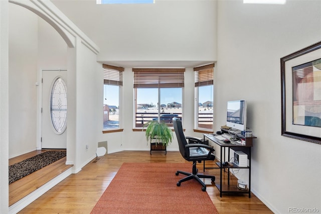 office area with light hardwood / wood-style flooring