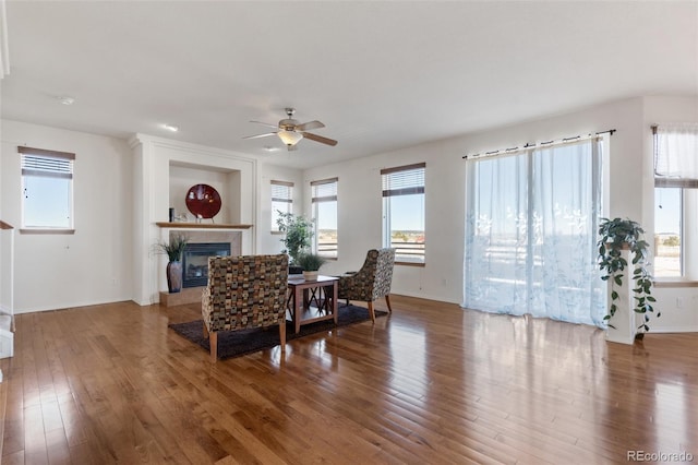 dining area with hardwood / wood-style flooring, ceiling fan, and a healthy amount of sunlight