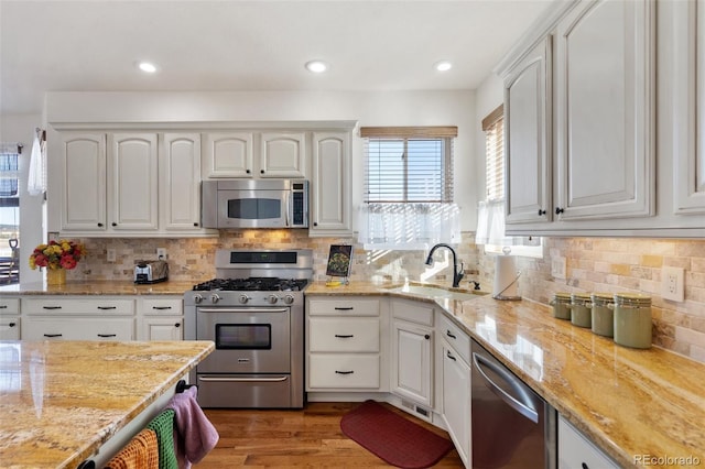 kitchen with appliances with stainless steel finishes and white cabinets